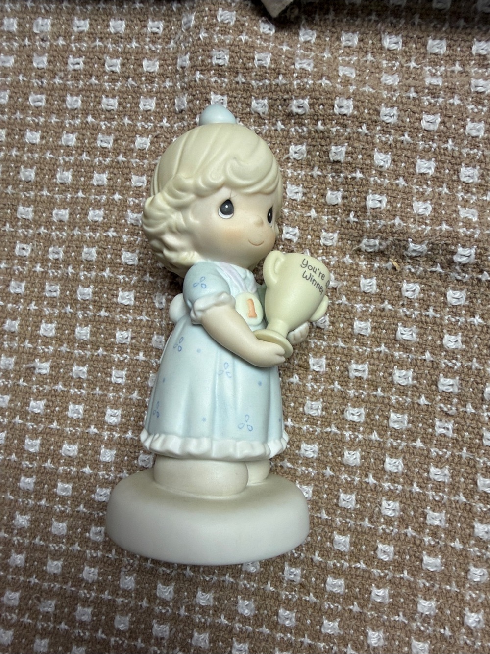 Precious Moments Pale Blue Girl Figurine Holding Trophy
